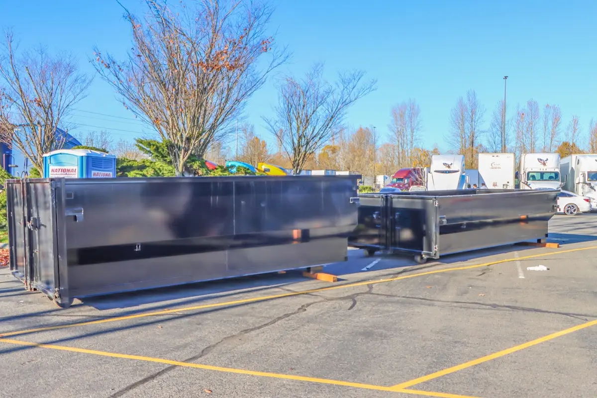 Professional dumpster rental service with roll-off container on residential driveway in Glenn Dale